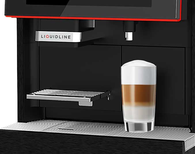 Coffee on the stand of the coffee machine which has just been made